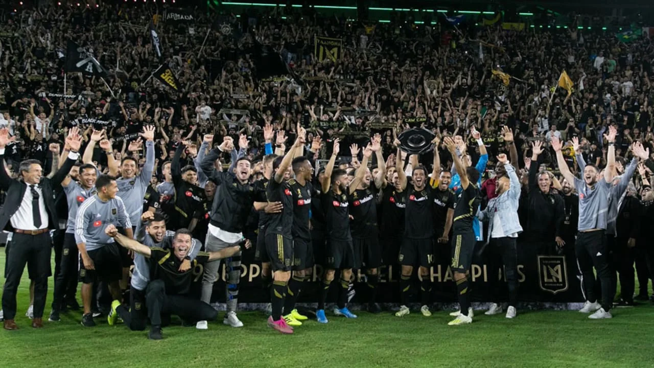 LAFC players and staff celebrate their 2019 Supporters' Shield on the field