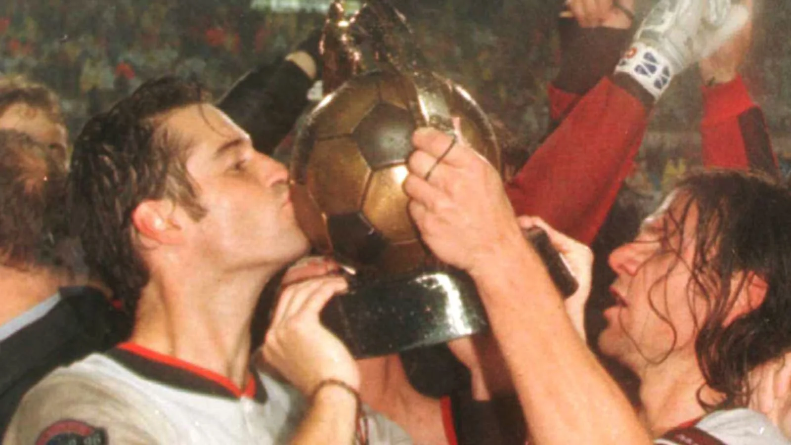D.C. United players celebrate with the early MLS Cup trophy